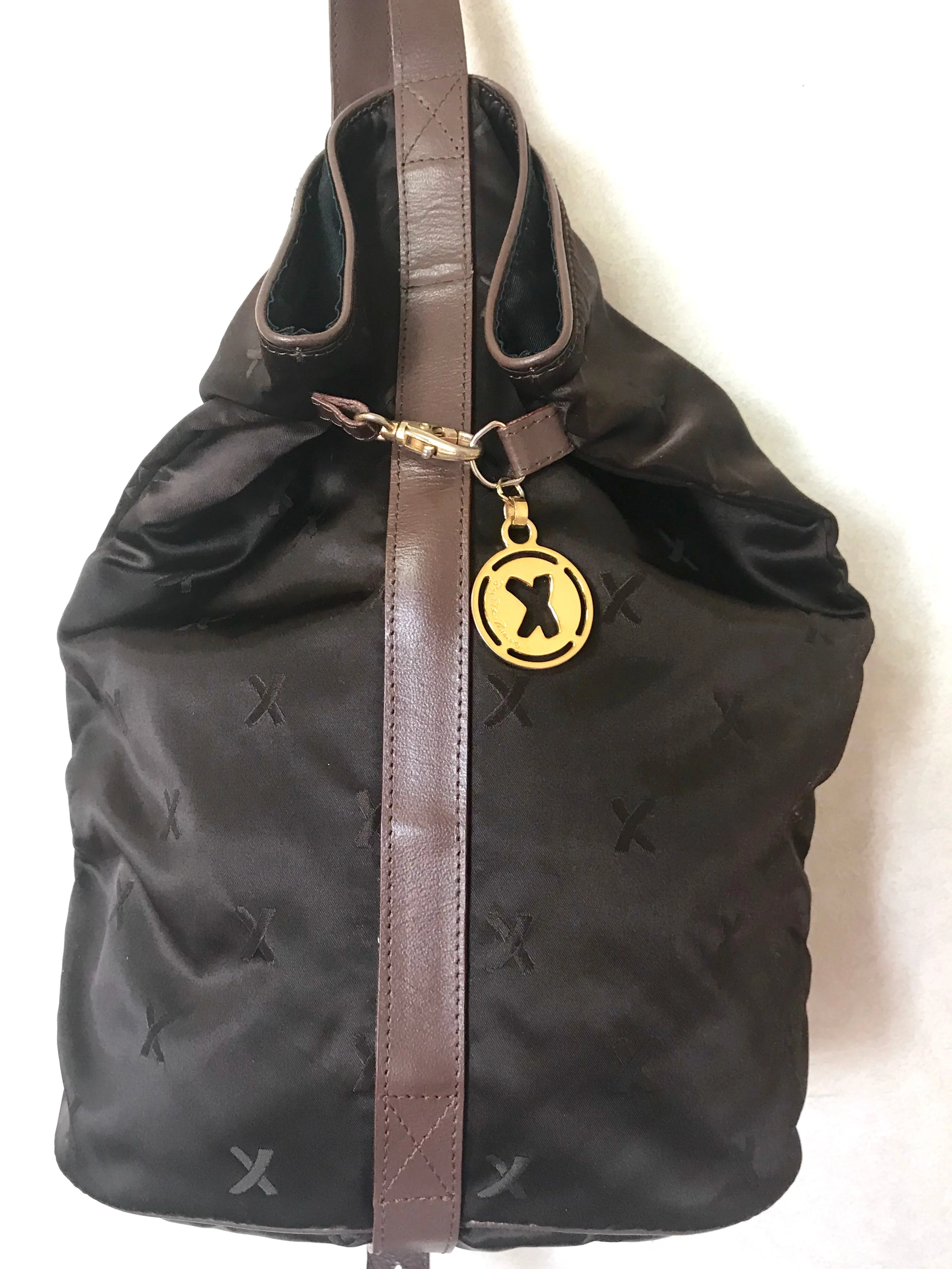 Vintage Paloma Picasso brown satin logo jacquard hobo shoulder bag with leather trimmings and golden logo charm. Classic bag for daily use.