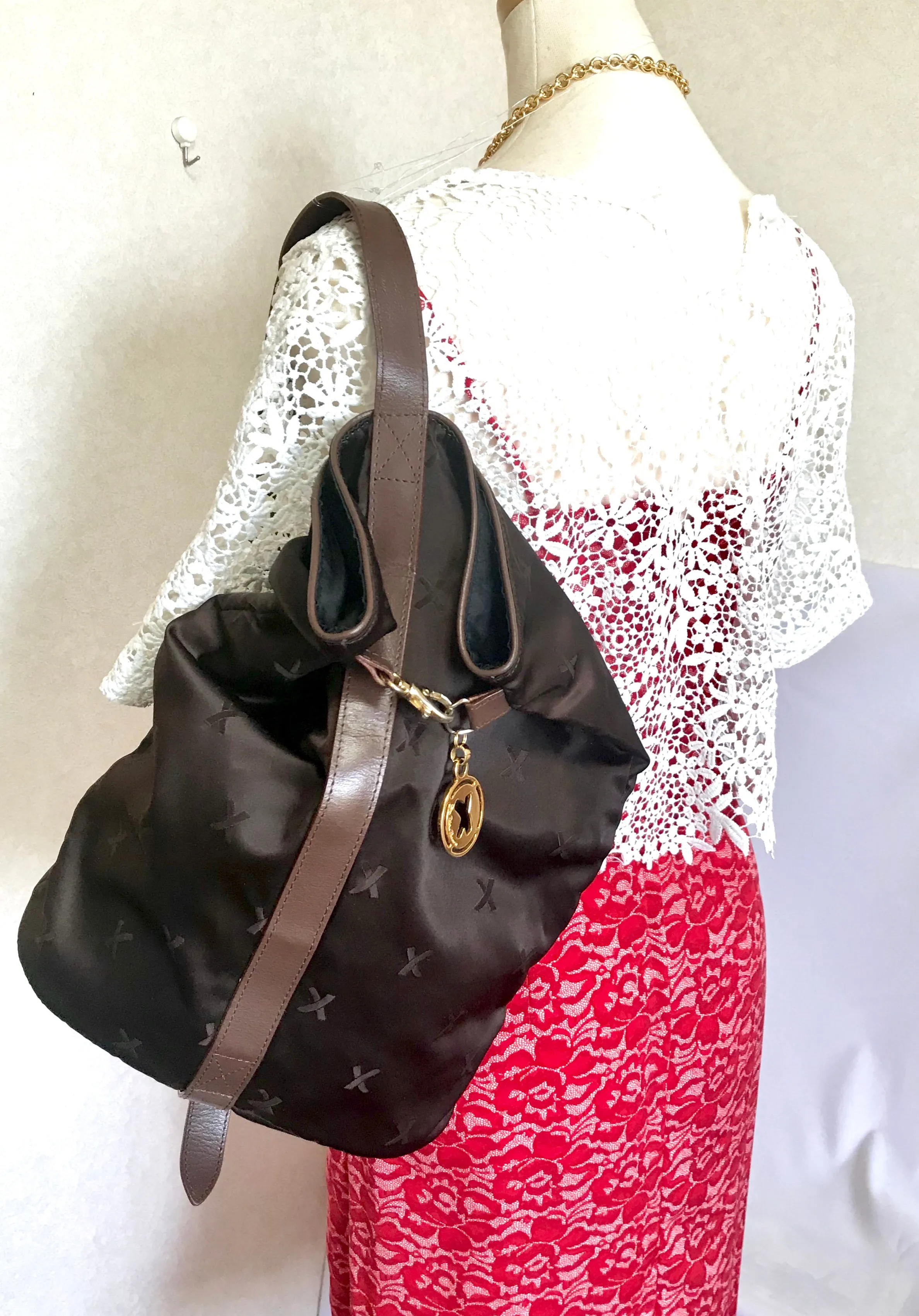 Vintage Paloma Picasso brown satin logo jacquard hobo shoulder bag with leather trimmings and golden logo charm. Classic bag for daily use.